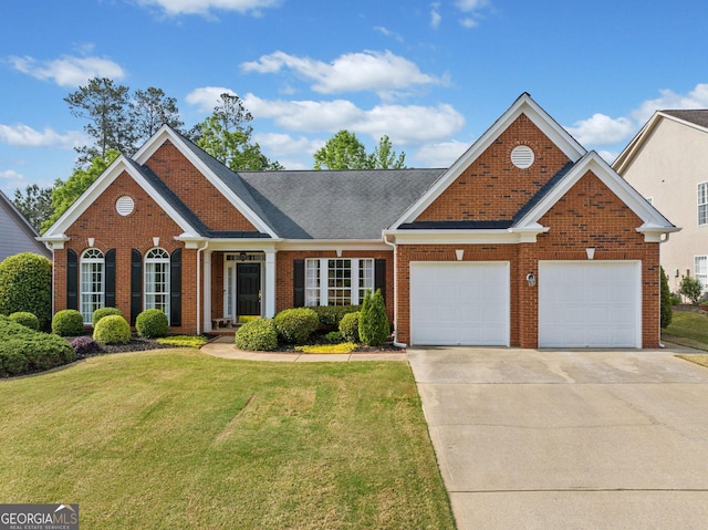 view of front of property with brick siding, an attached garage, driveway, and a front yard