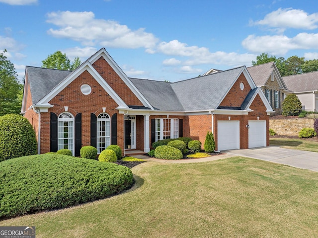 view of front of house featuring concrete driveway, brick siding, a garage, and a front lawn