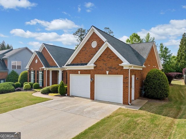 view of front of home with brick siding, a shingled roof, driveway, and a front yard