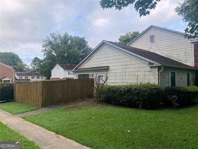 2617 Terrace Pkwy, Morrow, GA 30260 - view of side of home featuring fence and a lawn