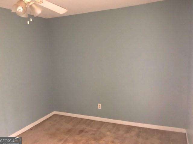 2617 Terrace Pkwy, Morrow, GA 30260 - empty room featuring a ceiling fan, carpet floors, and baseboards