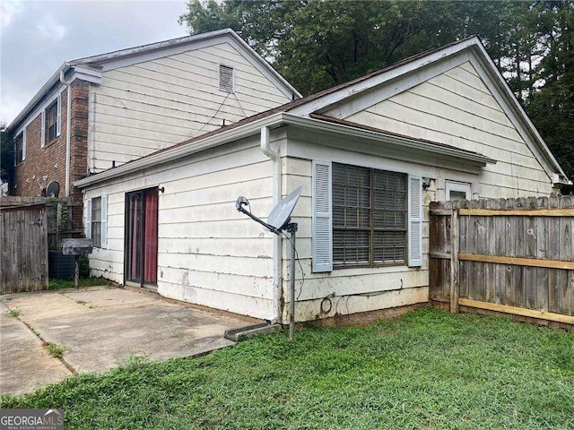 2617 Terrace Pkwy, Morrow, GA 30260 - view of home's exterior with fence, a lawn, and a patio area