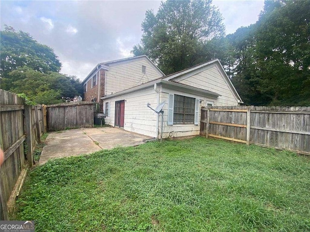 2617 Terrace Pkwy, Morrow, GA 30260 - rear view of property with a patio area, a fenced backyard, and a lawn