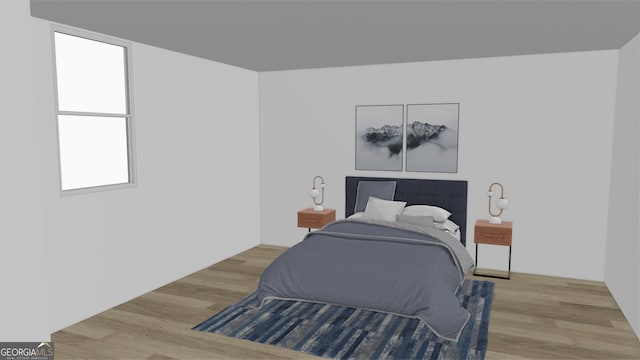 bedroom with wood finished floors