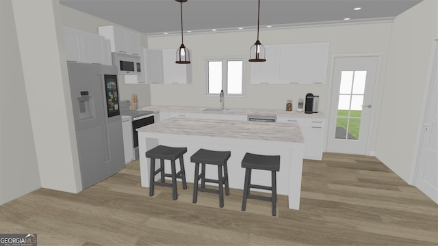 kitchen with white microwave, a breakfast bar, light countertops, a sink, and white cabinetry