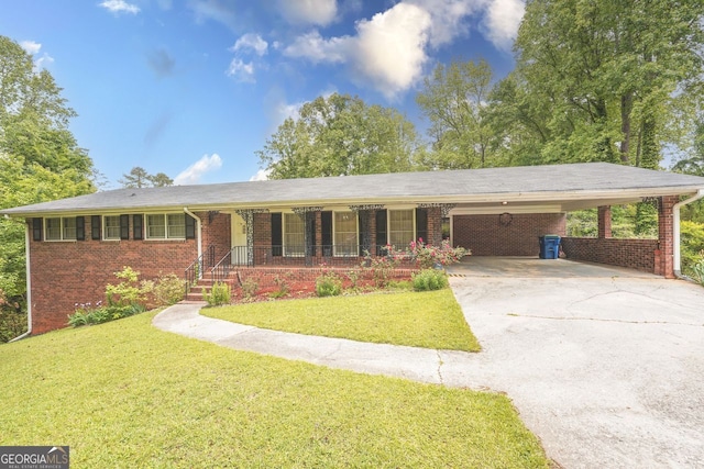 single story home featuring driveway, a front yard, and brick siding
