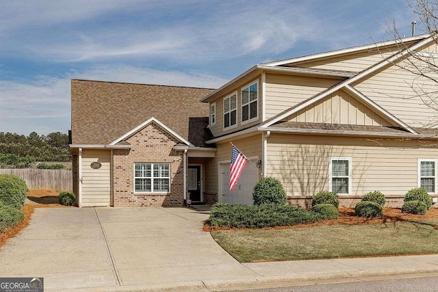 3262 Orchard Cir, Watkinsville, GA 30677 - view of front of house with fence, board and batten siding, and brick siding