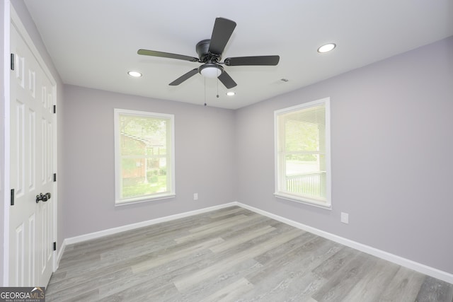 938 Motley St, Lagrange, GA 30241 - unfurnished bedroom with light wood-style floors, recessed lighting, and multiple windows