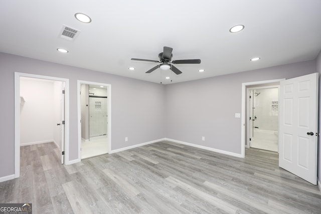 938 Motley St, Lagrange, GA 30241 - unfurnished bedroom featuring visible vents, light wood-type flooring, recessed lighting, and a walk in closet