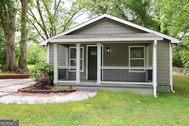 938 Motley St, Lagrange, GA 30241 - bungalow-style home featuring covered porch and a front yard