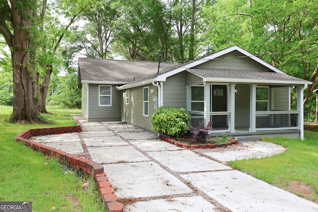 938 Motley St, Lagrange, GA 30241 - view of front of house with a porch, a front yard, and roof with shingles