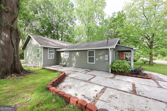 938 Motley St, Lagrange, GA 30241 - view of front of house with a shingled roof, a front lawn, and a patio area