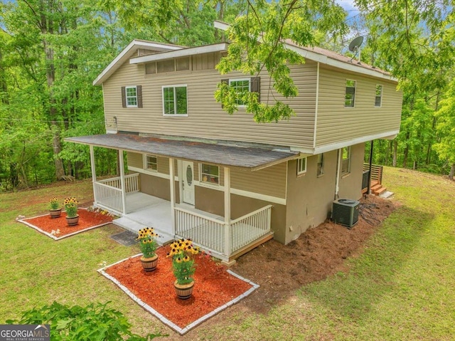 376 Mauldin Rd, Thomaston, GA 30286 - back of house with a lawn, cooling unit, and a porch