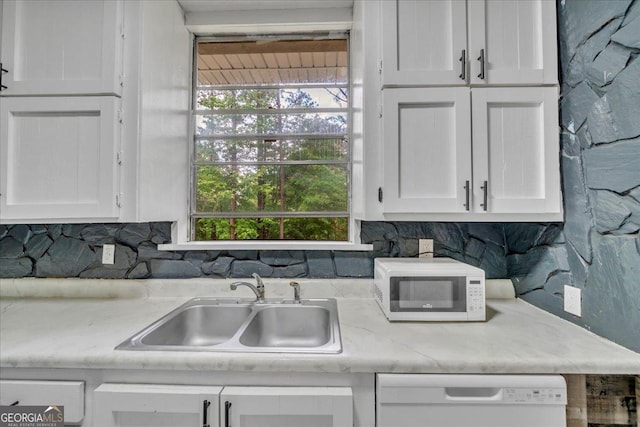 376 Mauldin Rd, Thomaston, GA 30286 - kitchen with tasteful backsplash, white cabinetry, white appliances, and a sink