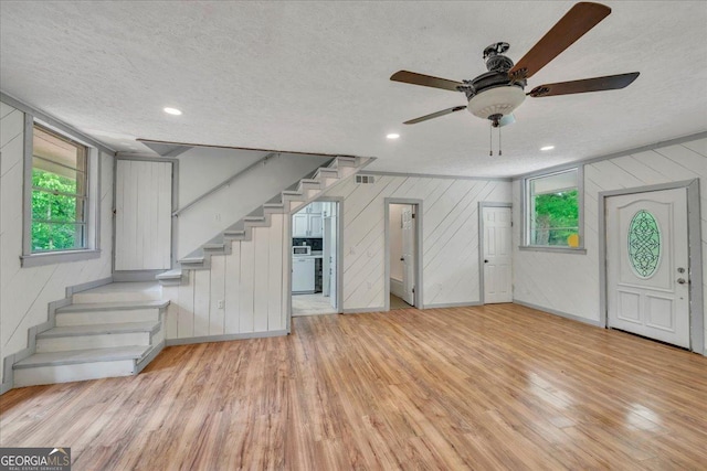 376 Mauldin Rd, Thomaston, GA 30286 - entryway featuring stairs, a textured ceiling, and light wood-style floors