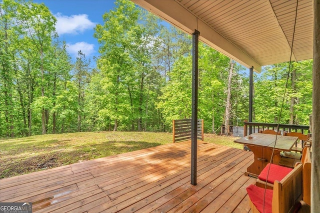 376 Mauldin Rd, Thomaston, GA 30286 - wooden deck with a lawn and a wooded view