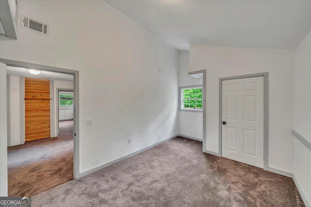 376 Mauldin Rd, Thomaston, GA 30286 - carpeted spare room featuring visible vents, a wealth of natural light, lofted ceiling, and baseboards
