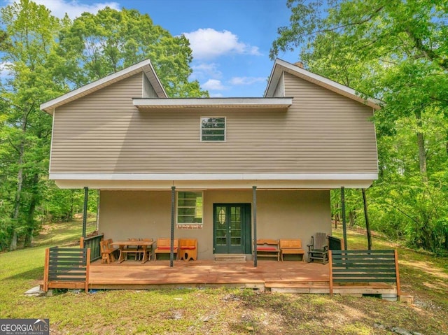 376 Mauldin Rd, Thomaston, GA 30286 - back of house with a deck, french doors, stucco siding, and a lawn