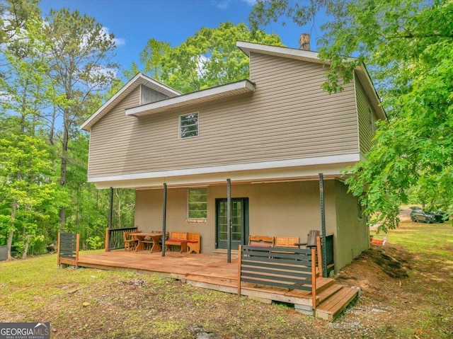 376 Mauldin Rd, Thomaston, GA 30286 - rear view of property featuring an outdoor hangout area, a wooden deck, stucco siding, and french doors