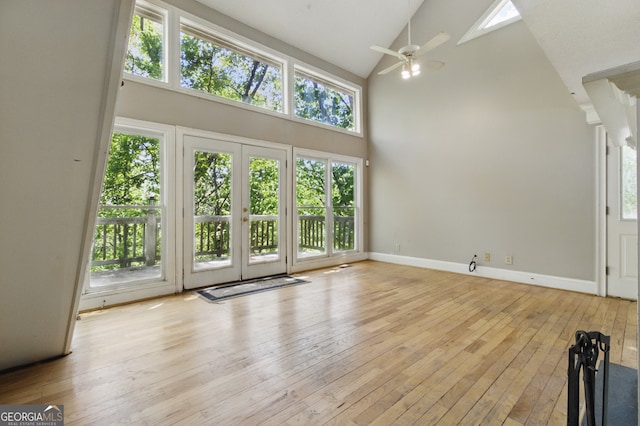 15635 US Highway 27 N, Hamilton, GA 31811 - unfurnished living room featuring baseboards, ceiling fan, hardwood / wood-style floors, and high vaulted ceiling
