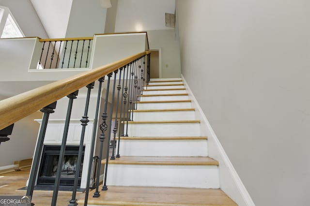 15635 US Highway 27 N, Hamilton, GA 31811 - stairway with baseboards, wood finished floors, and a towering ceiling