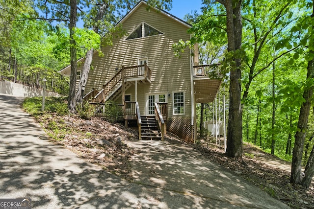15635 US Highway 27 N, Hamilton, GA 31811 - view of front of house with stairway, a deck, and driveway