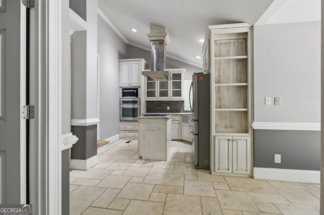 15635 US Highway 27 N, Hamilton, GA 31811 - kitchen featuring ornamental molding, a kitchen island, island range hood, appliances with stainless steel finishes, and vaulted ceiling