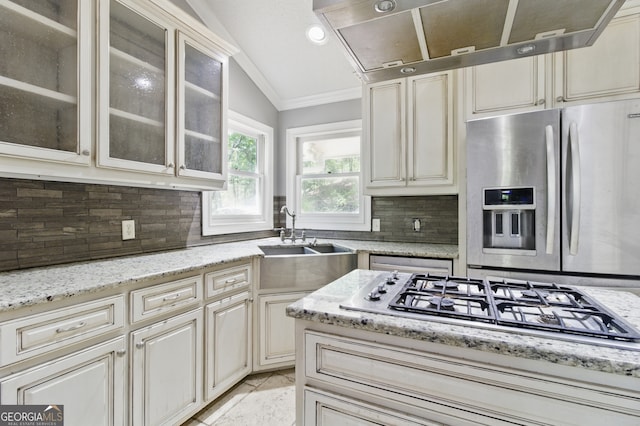 15635 US Highway 27 N, Hamilton, GA 31811 - kitchen with ornamental molding, decorative backsplash, lofted ceiling, cream cabinets, and stainless steel appliances