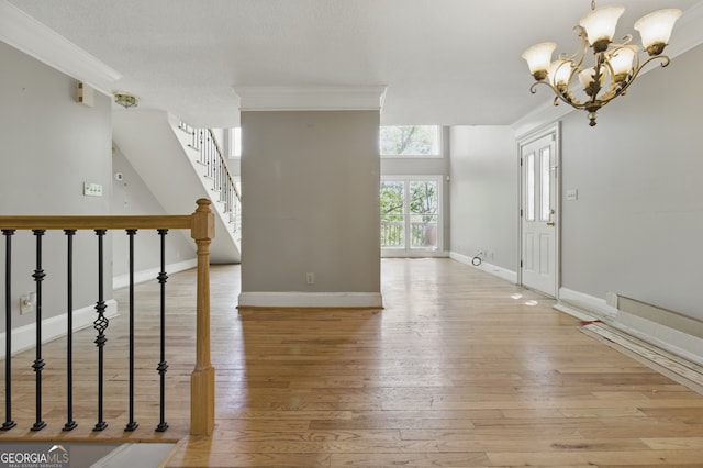 15635 US Highway 27 N, Hamilton, GA 31811 - entrance foyer featuring light wood-style floors, baseboards, ornamental molding, and stairs
