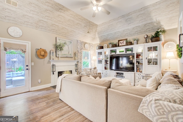 51 Norton Ave, Acworth, GA 30101 - living area featuring light wood finished floors, a ceiling fan, plenty of natural light, and baseboards