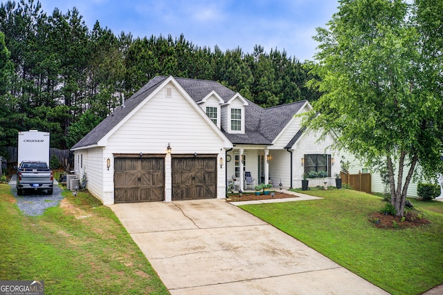 51 Norton Ave, Acworth, GA 30101 - view of front facade with a shingled roof, driveway, a garage, and central AC unit