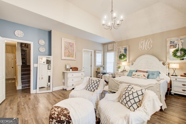 51 Norton Ave, Acworth, GA 30101 - bedroom featuring a chandelier, wood finished floors, baseboards, and high vaulted ceiling