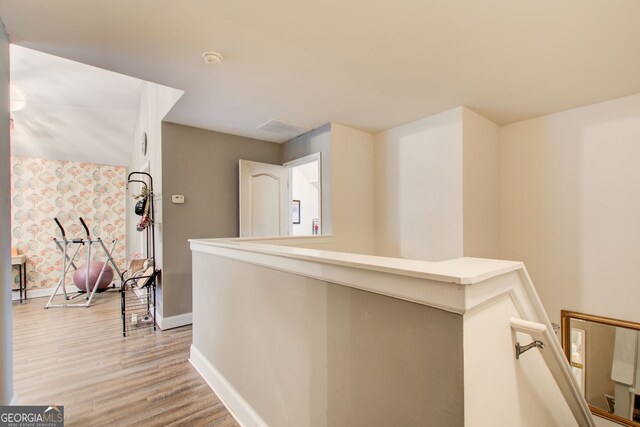 51 Norton Ave, Acworth, GA 30101 - hall with baseboards, light wood finished floors, an upstairs landing, and wallpapered walls
