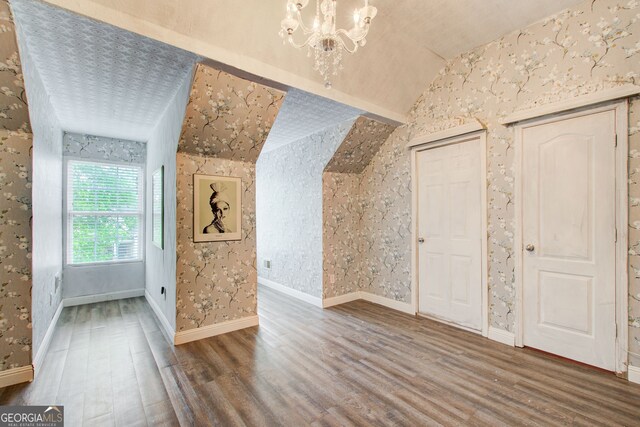 51 Norton Ave, Acworth, GA 30101 - bonus room with wood finished floors, wallpapered walls, vaulted ceiling, and a chandelier