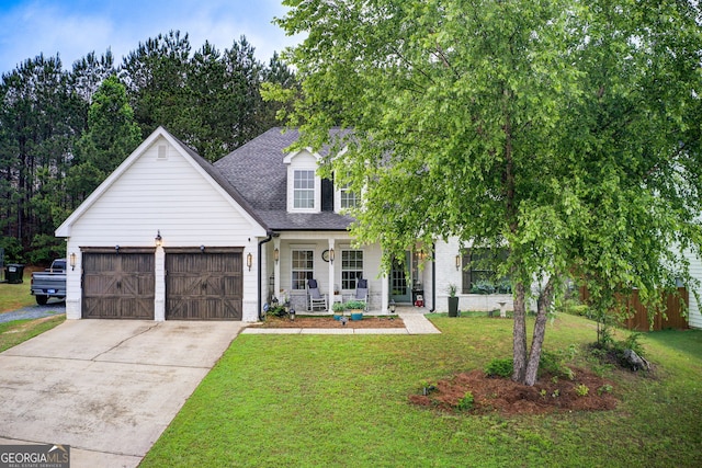 51 Norton Ave, Acworth, GA 30101 - view of front of house featuring a porch, driveway, an attached garage, a front lawn, and roof with shingles
