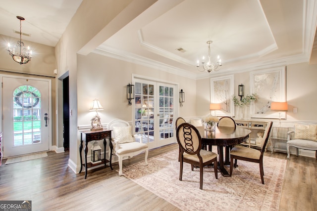 51 Norton Ave, Acworth, GA 30101 - dining area featuring a chandelier, french doors, a tray ceiling, wood finished floors, and ornamental molding