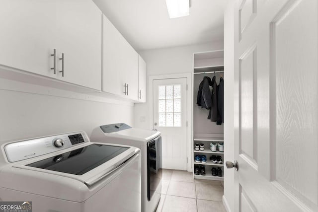 1900 Chattahoochee Run Dr, Suwanee, GA 30024 - laundry area featuring washing machine and clothes dryer, cabinet space, and light tile patterned floors