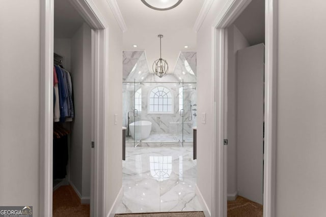 1900 Chattahoochee Run Dr, Suwanee, GA 30024 - hall featuring light marble finish floors, crown molding, a chandelier, and baseboards