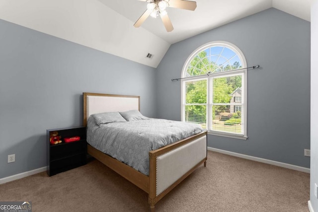 carpeted bedroom with baseboards, a ceiling fan, lofted ceiling, and visible vents