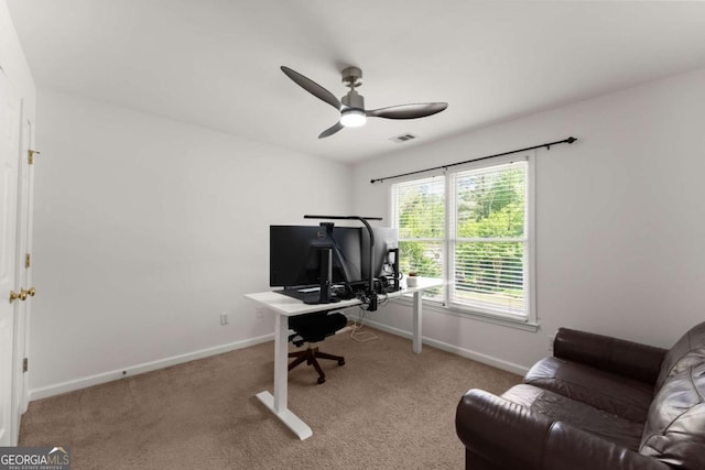home office featuring carpet flooring, a ceiling fan, baseboards, and visible vents