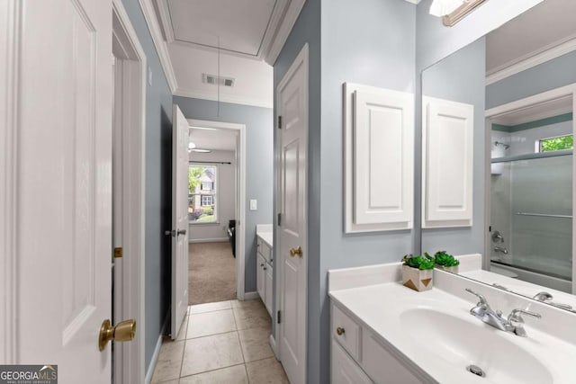 bathroom featuring crown molding, vanity, plenty of natural light, and visible vents