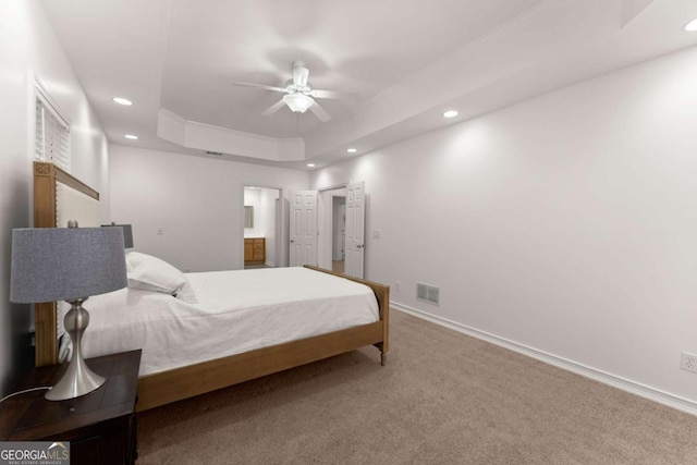 bedroom featuring visible vents, a raised ceiling, baseboards, carpet, and recessed lighting