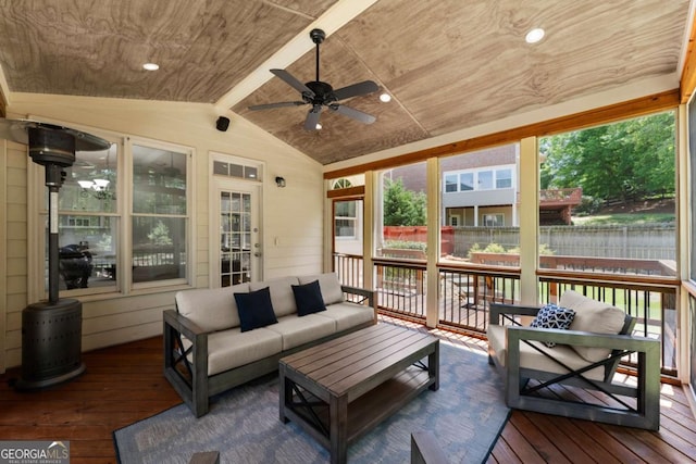 exterior space featuring fence, outdoor lounge area, and a ceiling fan