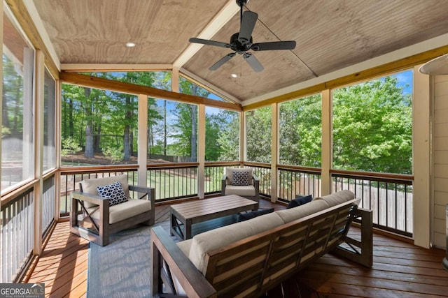 sunroom featuring ceiling fan and outdoor lounge area