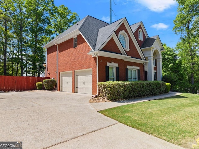 1900 Chattahoochee Run Dr, Suwanee, GA 30024 - view of side of property featuring concrete driveway, a garage, roof with shingles, and brick siding