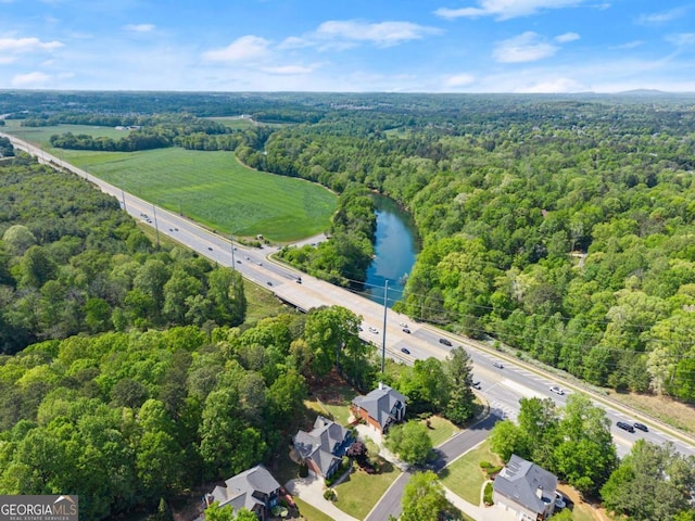 bird's eye view featuring a water view and a view of trees