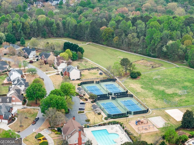 drone / aerial view featuring a view of trees