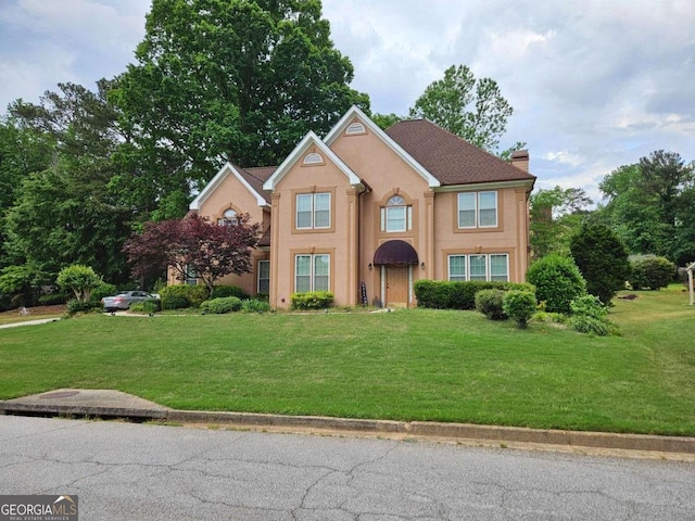 4299 Sherwood Oaks Dr, Decatur, GA 30034 - view of front facade with a chimney, stucco siding, and a front yard
