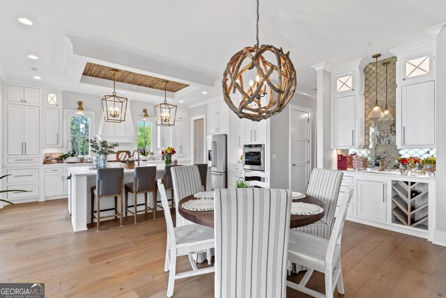 239 Lakeshore Cir, Milledgeville, GA 31061 - dining room with ornamental molding, a chandelier, and light wood-type flooring