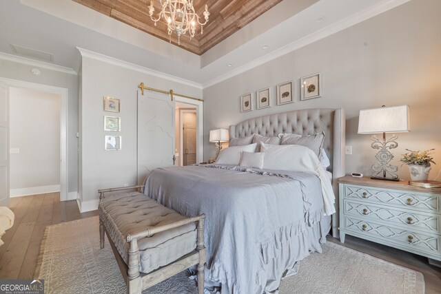 239 Lakeshore Cir, Milledgeville, GA 31061 - bedroom with baseboards, a raised ceiling, ornamental molding, and wood-type flooring